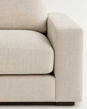Linea two-seater sofa beige linen cushion and arm detail